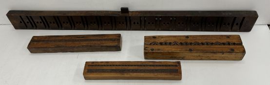 A set of three carved treenware frieze/framing moulds,