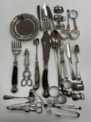 A collection of silver and silver plated wares to include a set of six silver handled butter knives,