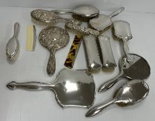 A sterling silver backed six-piece dressing table set in fitted case together with an embossed