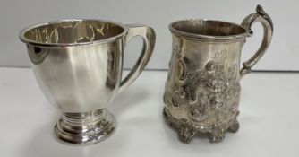 A Victorian silver Christening mug with embossed berry and scrolling decoration,
