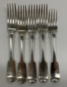 A set of four William IV silver “Fiddle” pattern table forks (by William Ely,