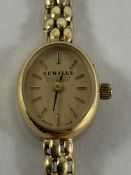 A Sewills ladies yellow metal wristwatch, the back plate stamped 