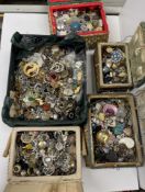 Five boxes of assorted costume jewellery to include pendants, earrings, etc.