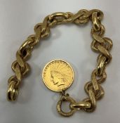 An 18-carat gold fancy engraved link snake type chain set with a United States of America $10 gold