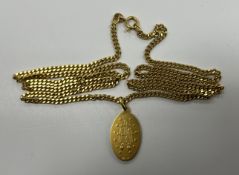 An 18-carat gold necklace set with 18-carat gold pendant depicting “The Virgin Mary”,