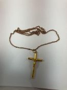 An 18-carat gold crucifix pendant, 1.4 g and a 9ct gold chain 3.