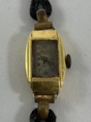 An 18-carat gold cased ladies evening watch with hairwork strap,