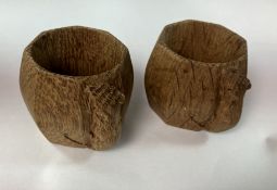A pair of oak Mouseman napkin rings of bulbous octagonal form,