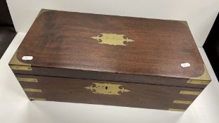A George IV mahogany and brass bound writing slope, the top with brass plaque inscribed 
