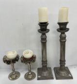 A pair of Kenneth Turner of London rose decorated pewter candle stands 25.