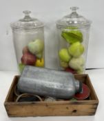 A box containing various rubber quoits and poles and mallet together with a white metal medallion
