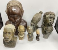 An African carved hardwood figural bust of a young man 41 cm high,