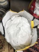 Two bags of assorted white sheets/tablecloths and napkins