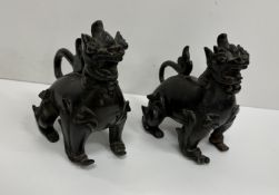 A pair of Chinese chocolate patinated bronze figures of dogs of Fo, approx 10.5 cm long x 11.