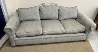 A modern three seat camel back sofa with scroll arms raised on bun feet 210 cm wide x 97 cm deep x
