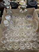 An elongated hexagonal cut glass decanter with silver fitting,