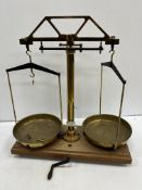 A pair of brass mid 20th Century laboratory scales with ivorine label inscribed 