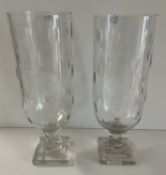 A pair of 20th Century cut glass hurricane lamps, the cylindrical bodies with bubble decoration,