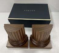 A pair of Linley carved walnut fluted column bookends on block bases,