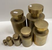 A set of seven 19th Century heavy brass troy ounce weights of cylindrical form including 500, 300,