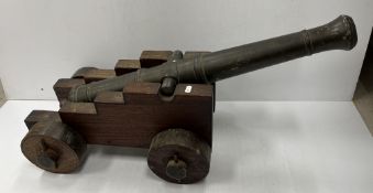 A 19th Century bronze cannon of typical form bearing armorial for Walter Hungerford Pollen on an