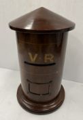 A Victorian mahogany country house postbox of cylindrical form with shallow conical cover,