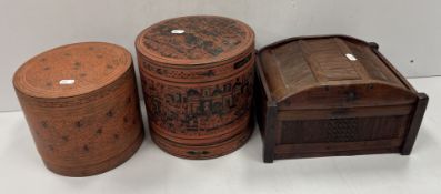A late 19th Century Burmese red and black lacquered betel box of cylindrical form,
