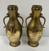 A pair of late 19th Century Chinese bronze and inlaid baluster shaped vases with lotus leaf