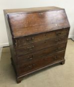 A late George III oak and cross-banded N