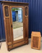 An early 20th Century oak single mirror