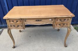 A modern walnut and stained beech dressi