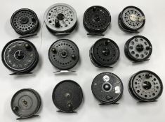 A Hardy canvas and leather fisherman's bag containing eleven various fly reels including J.W.