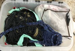 A box containing a large quantity of furnishing trim in navy,