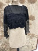 A quantity of vintage clothing to include top of an early 20th Century evening gown with heavily