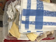 Three boxes containing various household linen, tablecloths, serviettes, doilies etc,