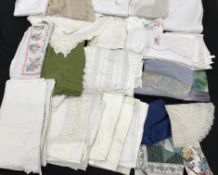 Three boxes, the first containing vintage textiles to include tablecloths, napkins, pillow cases,