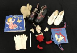 A quantity of vintage childrens clothes with a faux leather suitcase to include jodhpurs,