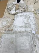 A box containing an embroidered single bed cover with shattered silk lining,