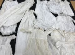 A quantity of babies and small child dresses, petticoats, nightdresses, christening gowns, hats,