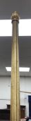 A gilt curtain pole of reeded form and with knop finials and rings,