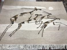 An African wool wall hanging depicting 