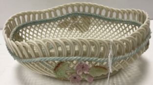 A Belleek basketwork bowl with applied f