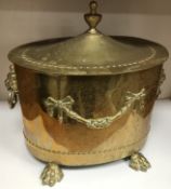 A 20th Century brass coal bucket in the