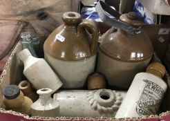 A box of assorted stoneware flagons and