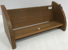 An oak book trough with carved mouse mot