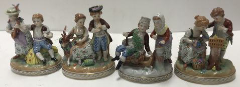 A set of four Potschappel Dresden figure