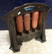 An Arts & Crafts style copper fronted el