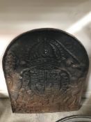 A cast iron fire back depicting Royal co