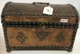 A 19th Century brass studded leather dom