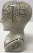 A pottery phrenology head inscribed 